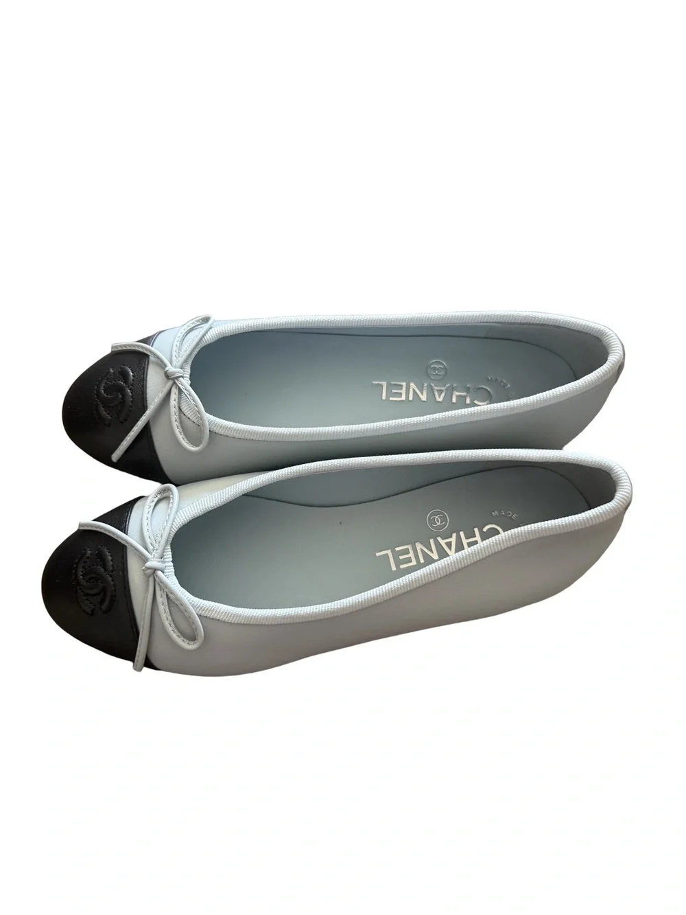 CHANEL Light Blue Leather Ballet Flats with Black Cap Toe and Bow